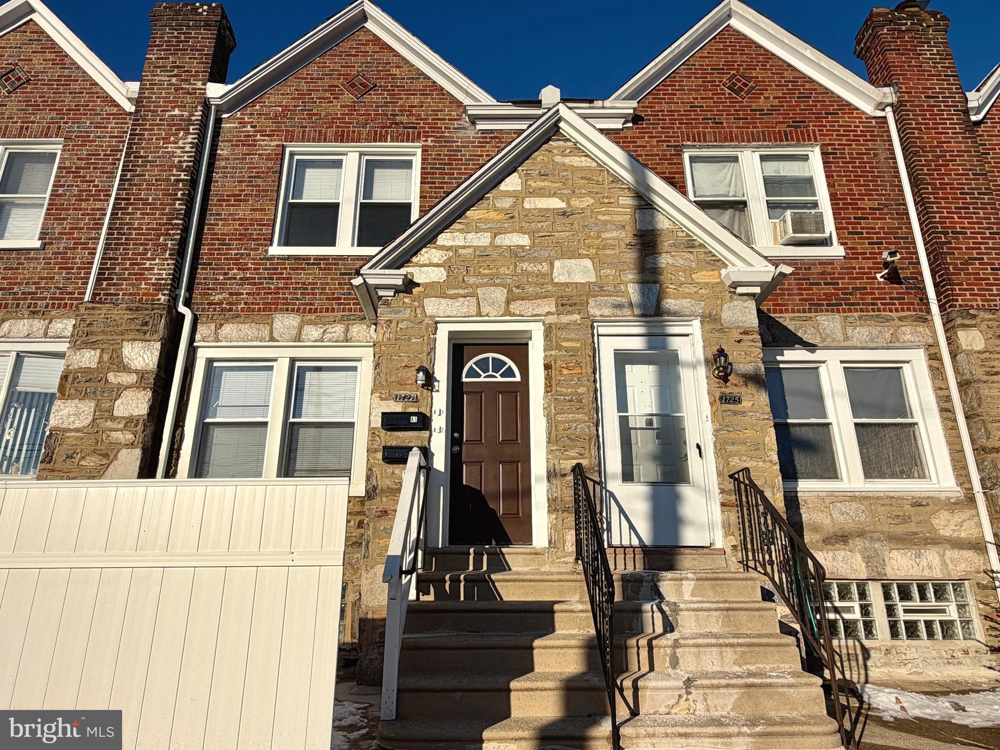 1727 Dallas Street, Unit 2 Philadelphia, PA 19126 - Photo 4 of 15 a view of a brick house with large windows