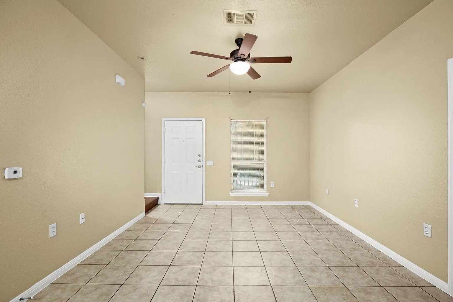 1812 Maple Avenue, Unit A Austin, TX 78702 - Photo 3 of 10 a view of an empty room with a window