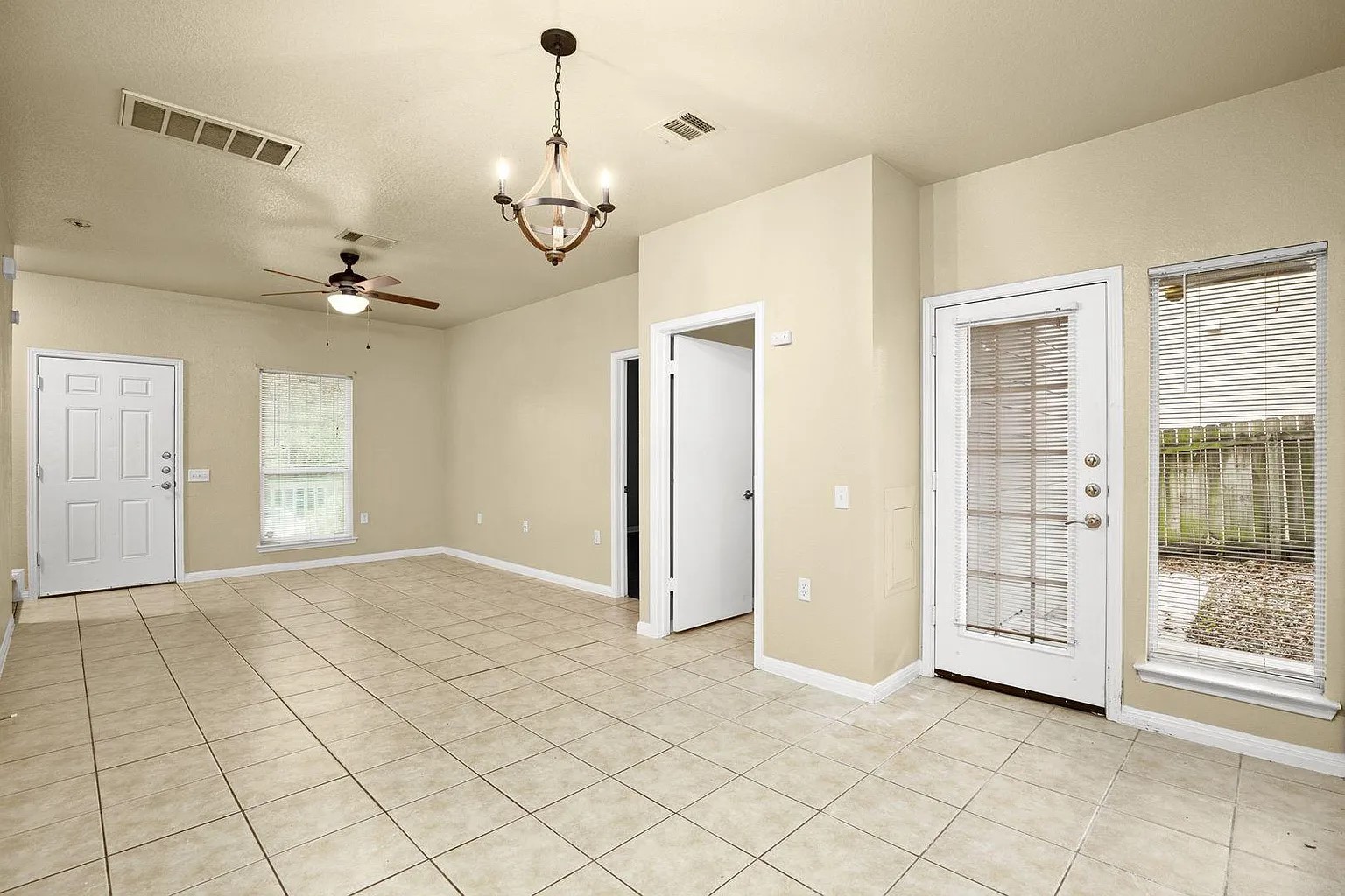 1812 Maple Avenue, Unit A Austin, TX 78702 - Photo 4 of 10 wooden floor in an empty room with a window