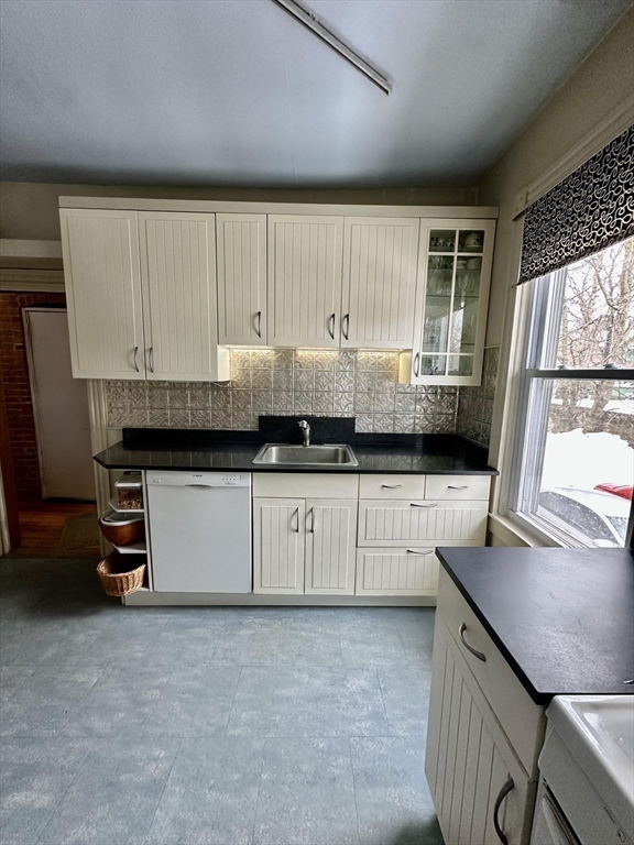 81 Francis Street, Unit 2 Brookline, MA 02446 - Photo 4 of 9 a kitchen with a sink and cabinets