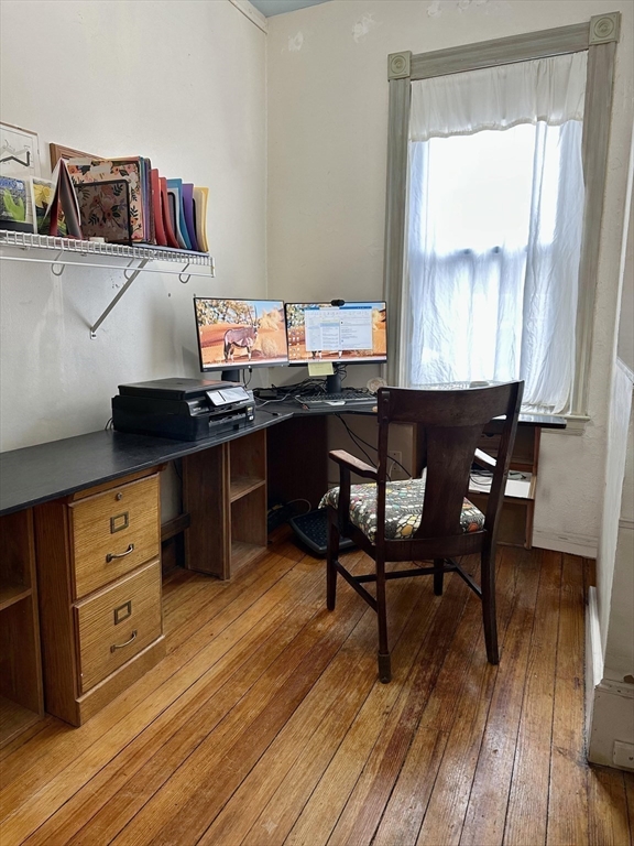 81 Francis Street, Unit 2 Brookline, MA 02446 - Photo 5 of 9 a kitchen with a wooden table and chairs