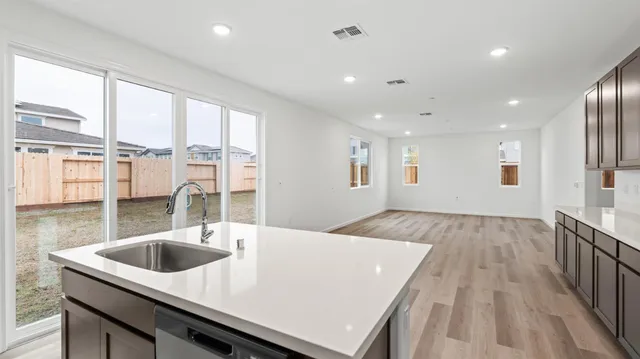 a kitchen with a sink a counter space and a sink