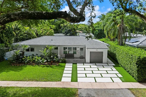 a view of house with garden and pathway