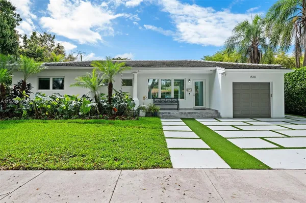 front view of a house with a yard