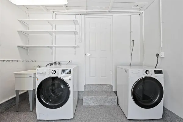 a utility room with dryer and washer