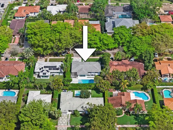 an aerial view of a house with a garden