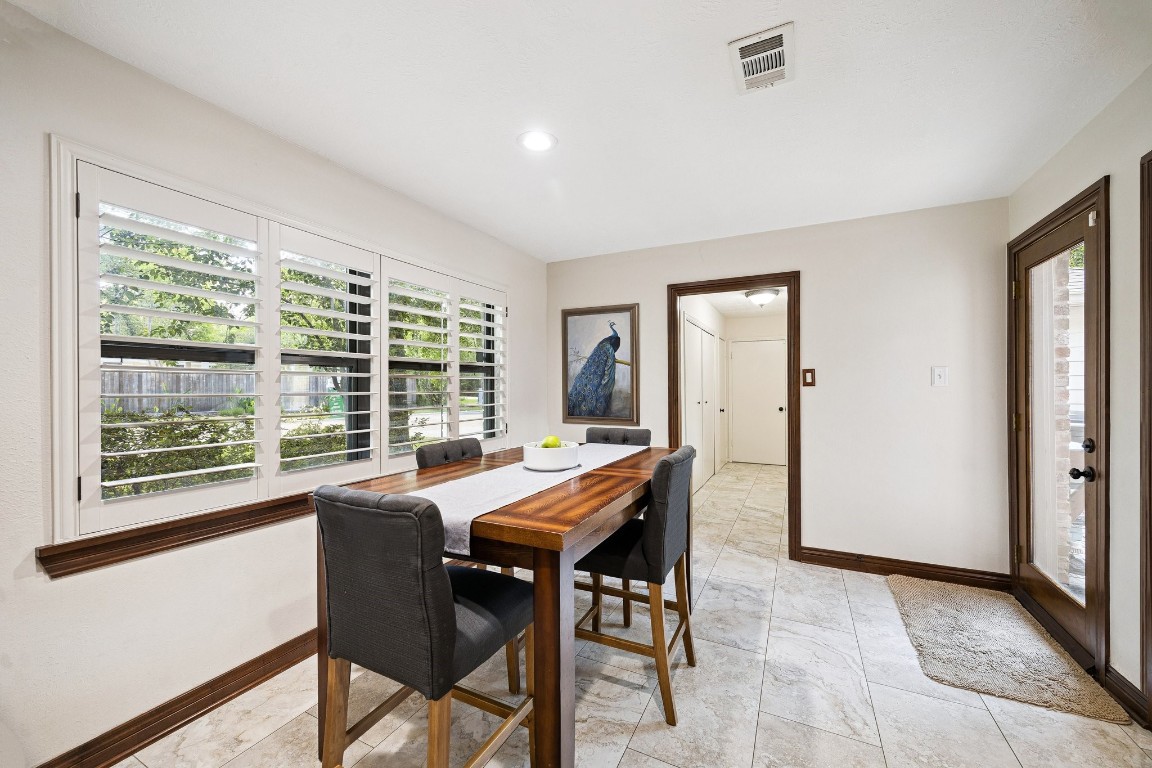 2 Chatterbird Spring, TX 77380 - Photo 15 of 40 a view of a dining room with furniture window and outside view