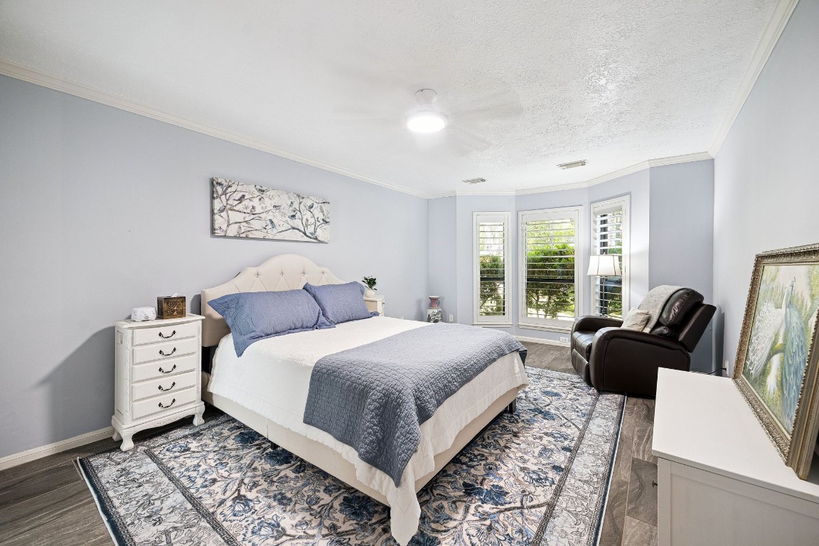 2 Chatterbird Spring, TX 77380 - Photo 19 of 40 a bedroom with a bed couch and a window
