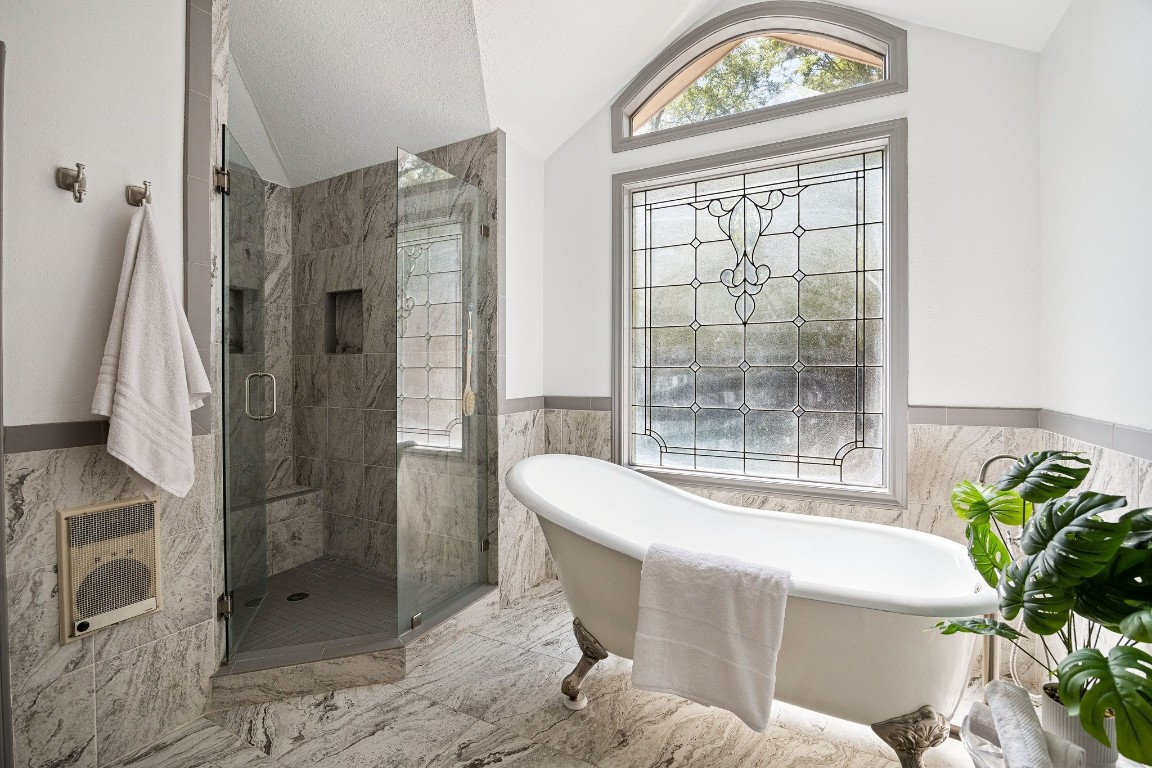 2 Chatterbird Spring, TX 77380 - Photo 20 of 40 Spa-inspired Primary bath with walk-in shower, claw-foor soaking tub and large custom window letting in light from the backyard.