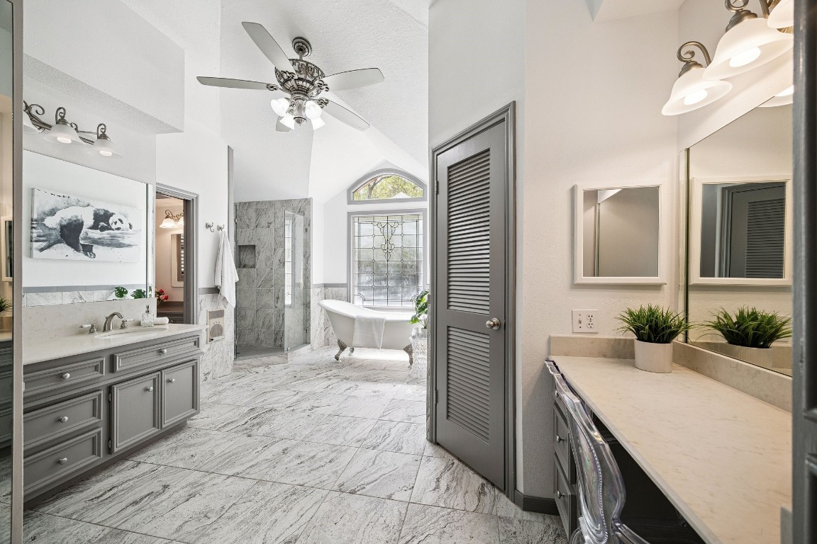 2 Chatterbird Spring, TX 77380 - Photo 21 of 40 Primary bathroom has two vanities plus the makeup station - Two walk-in closets - a very large walk-in shower and a claw footed soaking tub. Expanded and completely renovated in 2017.