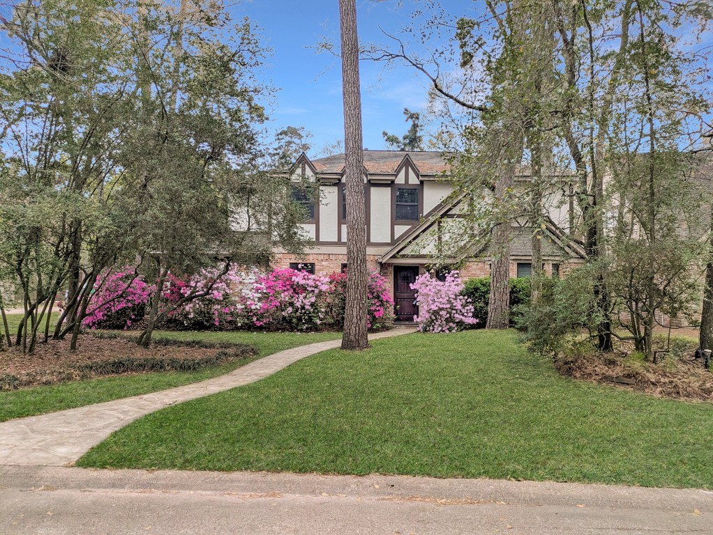 2 Chatterbird Spring, TX 77380 - Photo 38 of 40 a front view of a building with play ground and a fountain