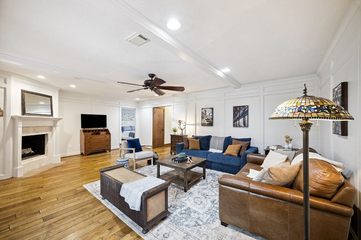 2 Chatterbird Spring, TX 77380 - Photo 9 of 40 a living room with furniture a fireplace and a flat screen tv