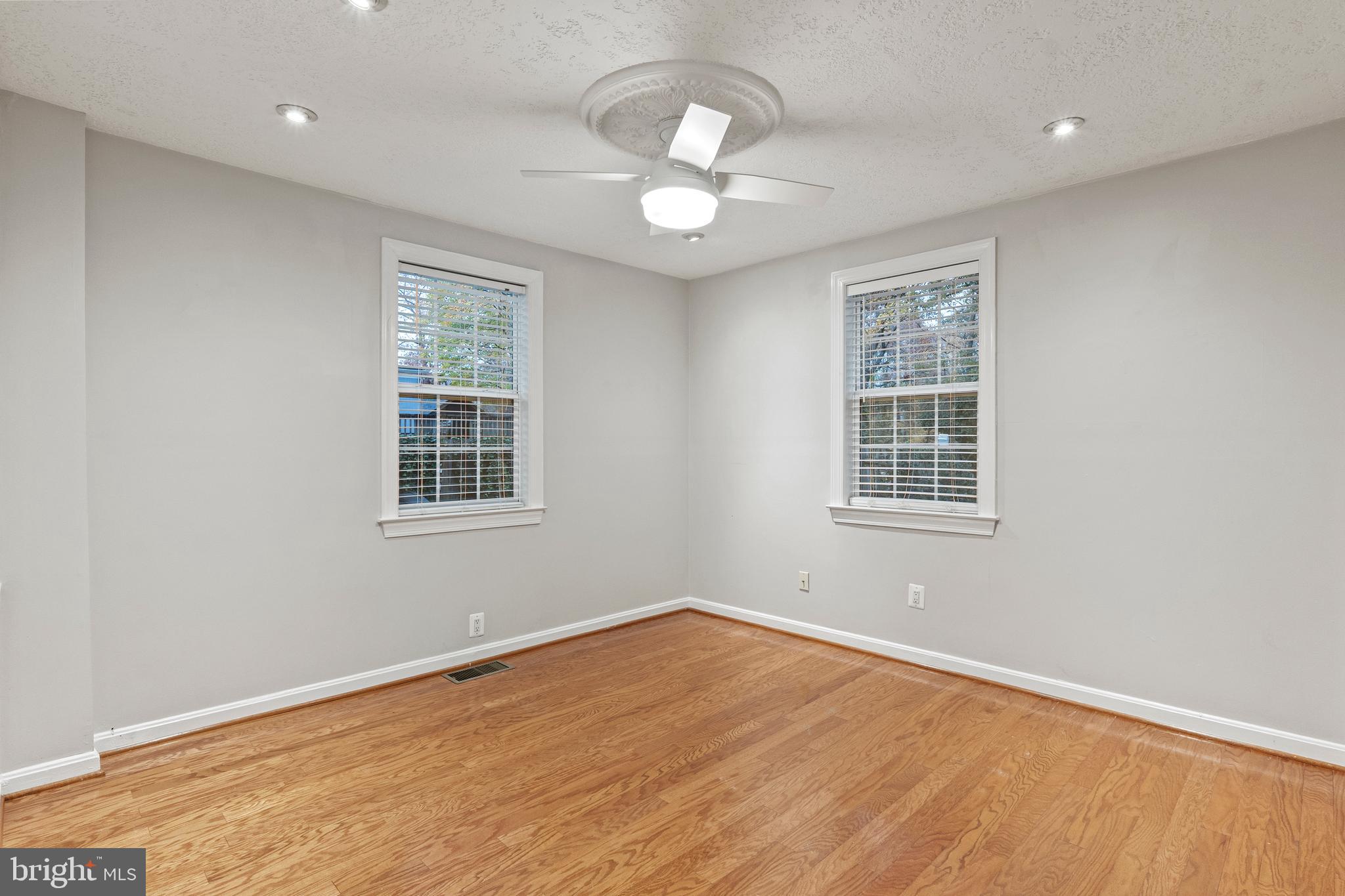 75 Silopanna Road Annapolis, MD 21403 - Photo 11 of 33 wooden floor in an empty room with a window