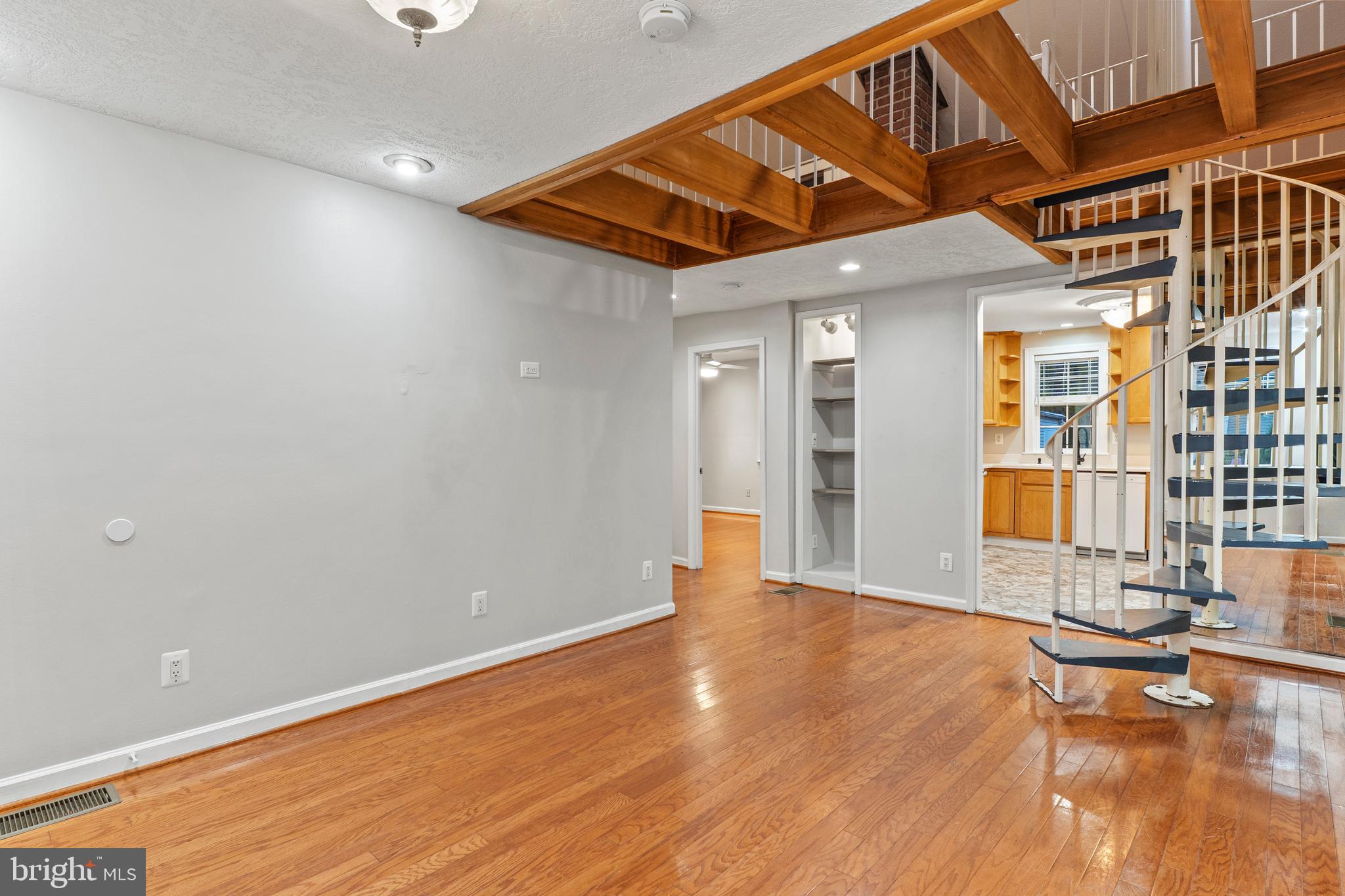 75 Silopanna Road Annapolis, MD 21403 - Photo 5 of 33 a view of an empty room with wooden floor and a window