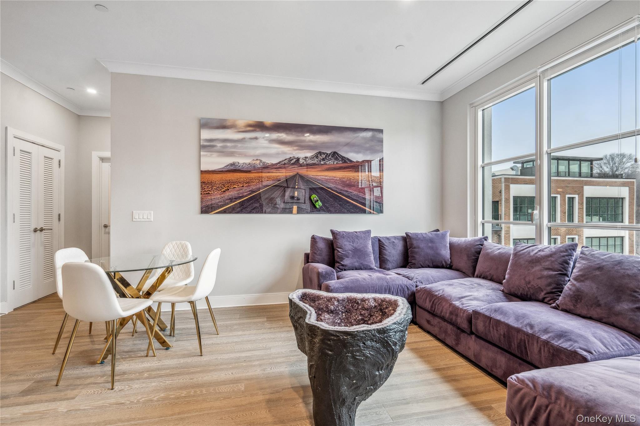 100 Garvies Point Road, Unit 1327 Glen Cove, NY 11542 - Photo 15 of 20 a living room with furniture and a large window