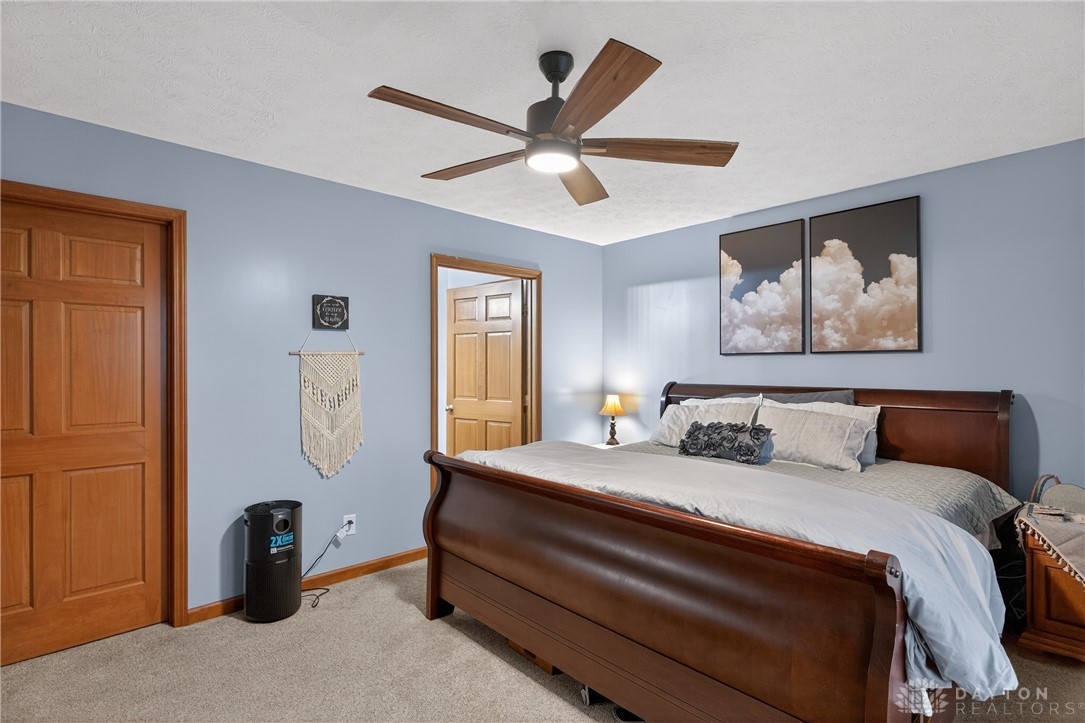 5264 Frazier-Guy Road Sidney, OH 45365 - Photo 23 of 51 This serene bedroom offers comfort and a tranquil atmosphere for restful nights.