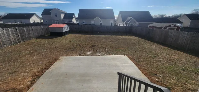a view of a living room and wooden floor