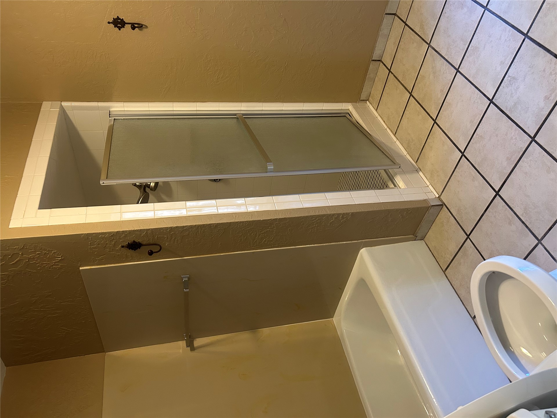 2913 Springdale Lane Duncan, OK 73533 - Photo 10 of 32 Tile flooring featuring contrasting grout, full bathtub, and shower enclosure with a frosted glass door