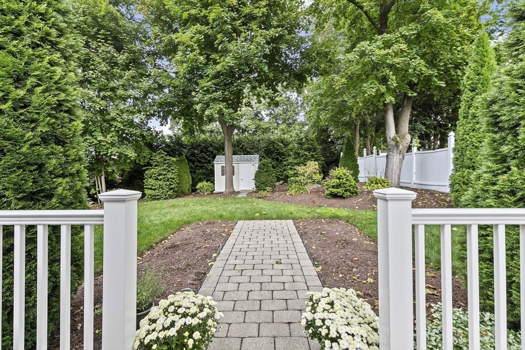 166 Phipps Street Quincy, MA 02169 - Photo 18 of 21 a view of a pathway with a wrought fence