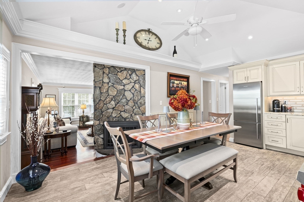 166 Phipps Street Quincy, MA 02169 - Photo 6 of 21 a view of a dining room with furniture a chandelier and wooden floor