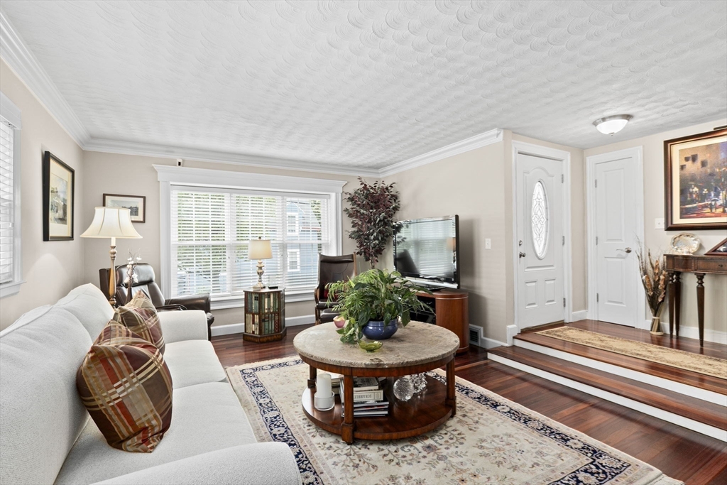166 Phipps Street Quincy, MA 02169 - Photo 8 of 21 a living room with furniture a table and a large window