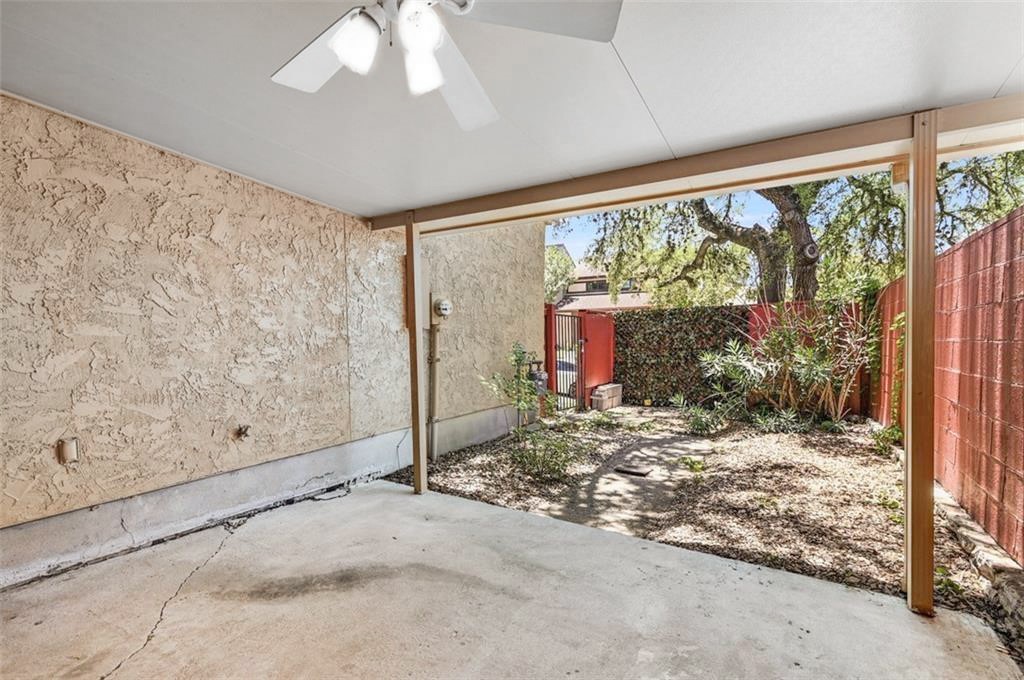 8704 Merion Circle Austin, TX 78754 - Photo 14 of 16 Covered Outdoor area 2. View of patio featuring a ceiling fan and a fenced backyard.