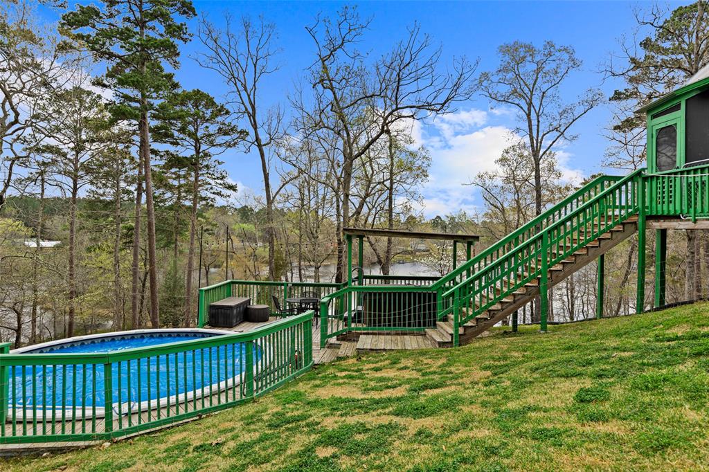 5066 Bob O Link Road Gilmer, TX 75645 - Photo 29 of 30 a view of deck with furniture and trees around