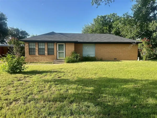 a front view of a house with yard