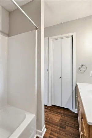 a bathroom with a tub and shower