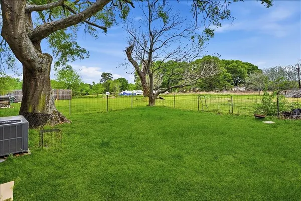 a view of a park with large trees