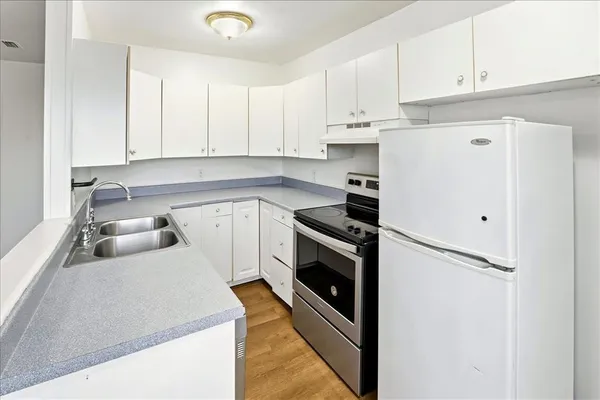 a bedroom with a bed and a sink