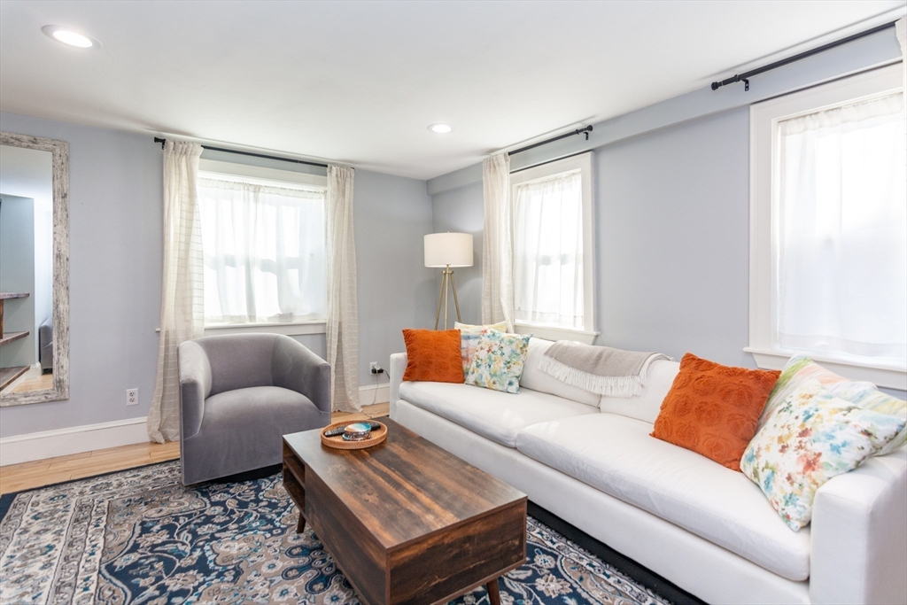 38 Colonial Drive Dedham, MA 02026 - Photo 12 of 28 a living room with furniture and a window