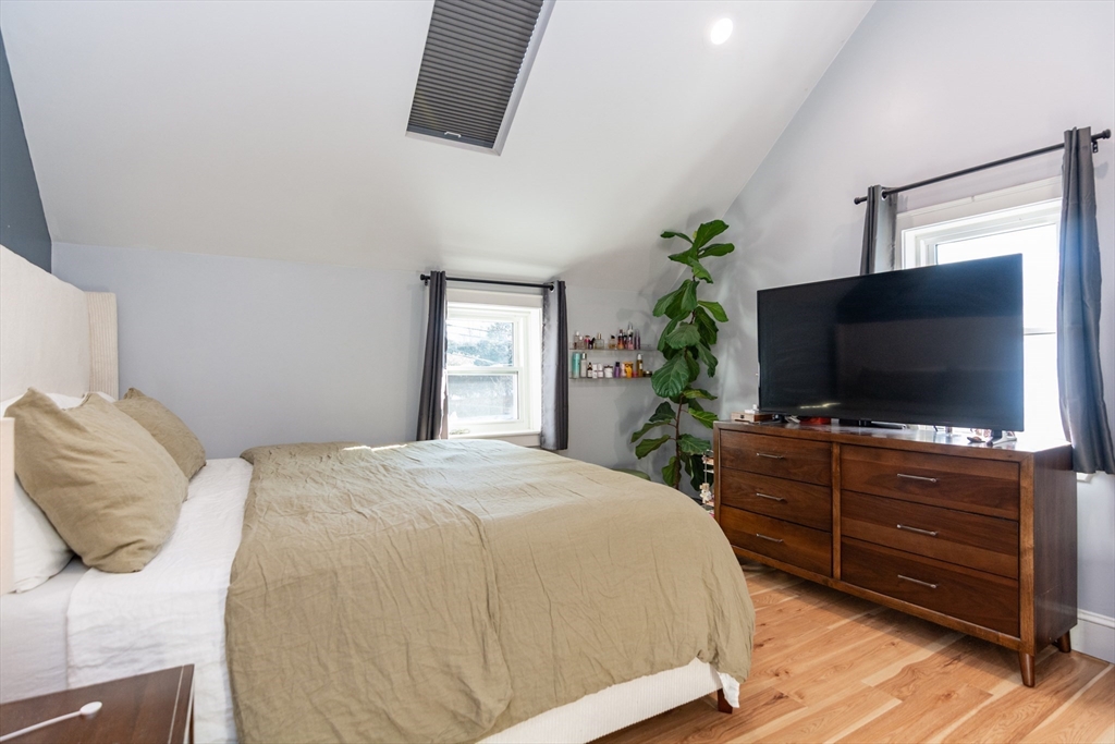 38 Colonial Drive Dedham, MA 02026 - Photo 14 of 28 a bedroom with a bed and a flat screen tv