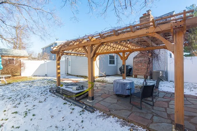 a backyard of a house with outdoor seating