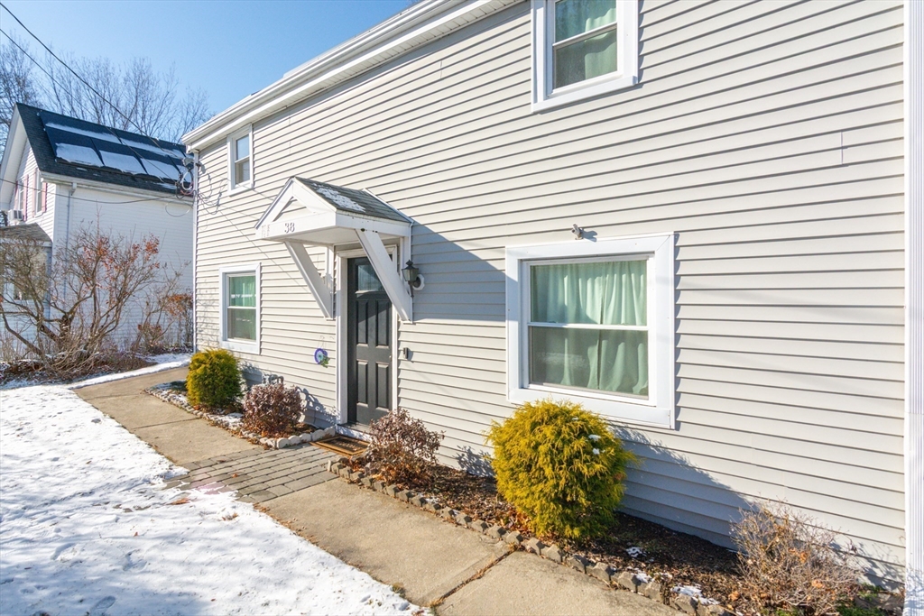 38 Colonial Drive Dedham, MA 02026 - Photo 25 of 28 a front view of a house