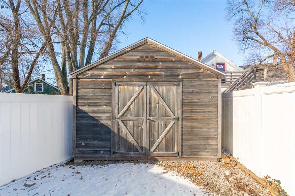 38 Colonial Drive Dedham, MA 02026 - Photo 26 of 28 a front view of a house with a yard