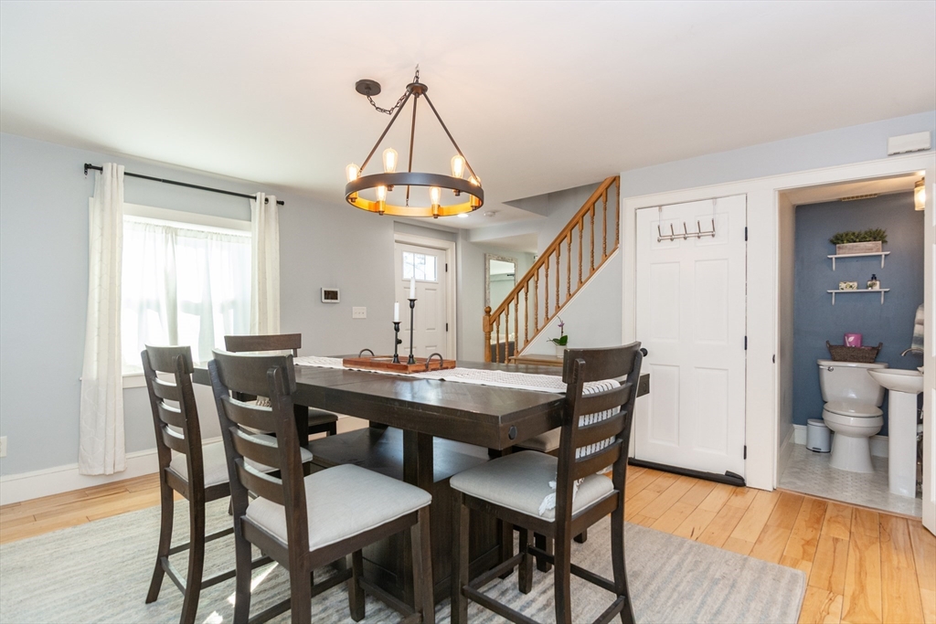38 Colonial Drive Dedham, MA 02026 - Photo 6 of 28 a view of a dining room with furniture window and wooden floor