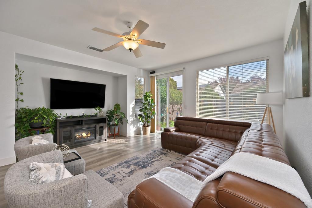 250 Pelican Bay Circle Sacramento, CA 95835 - Photo 31 of 71 a living room with furniture a flat screen tv and a large window