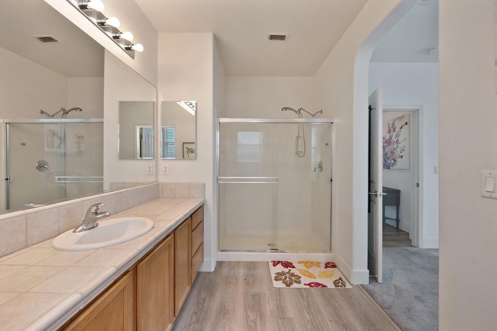 250 Pelican Bay Circle Sacramento, CA 95835 - Photo 42 of 71 a bathroom with a sink double vanity granite tub shower and mirror