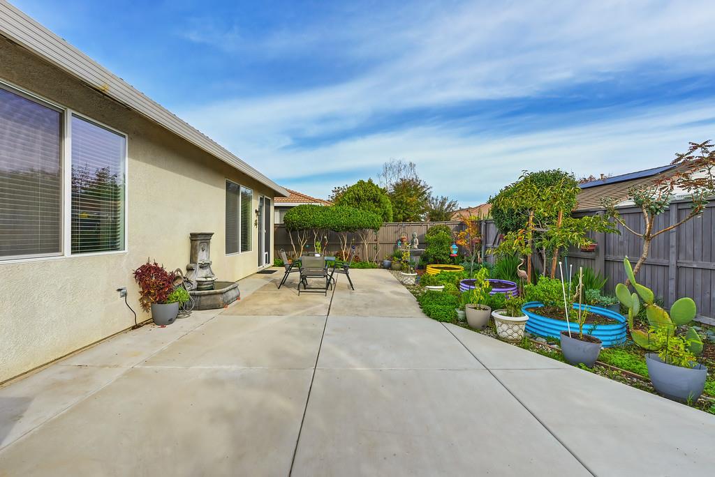 250 Pelican Bay Circle Sacramento, CA 95835 - Photo 55 of 71 a view of a patio with couches table and chairs and potted plants