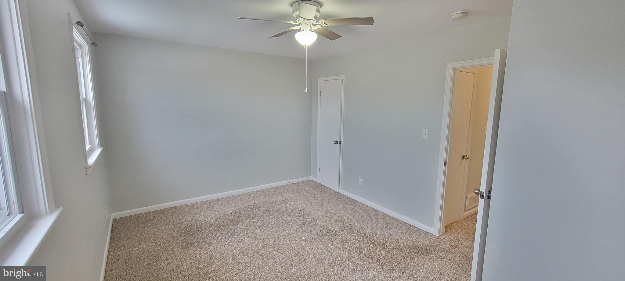 452 Westfield Road Dundalk, MD 21222 - Photo 18 of 34 an empty room with closet and a chandelier fan