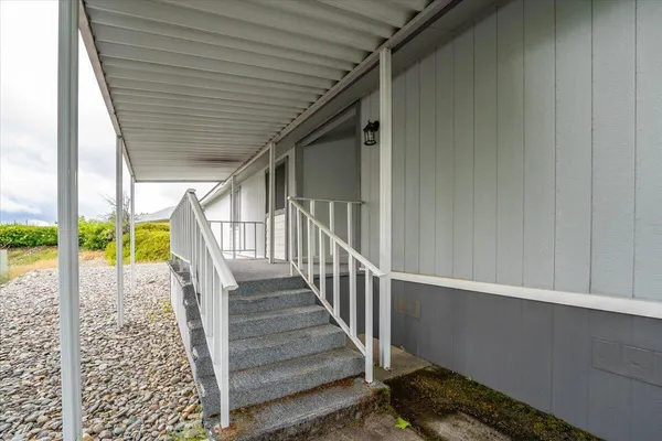 a view of balcony with wooden floor
