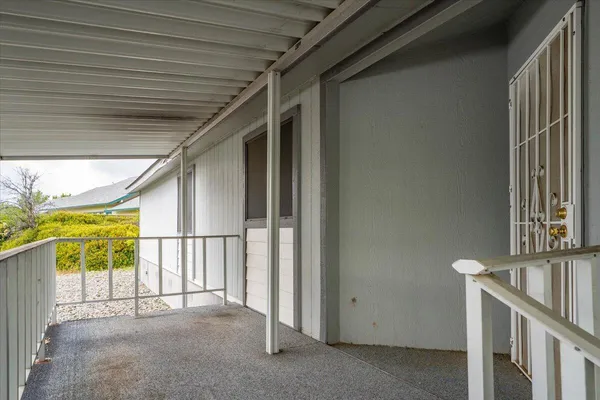 a front view of a house with a yard and a garage