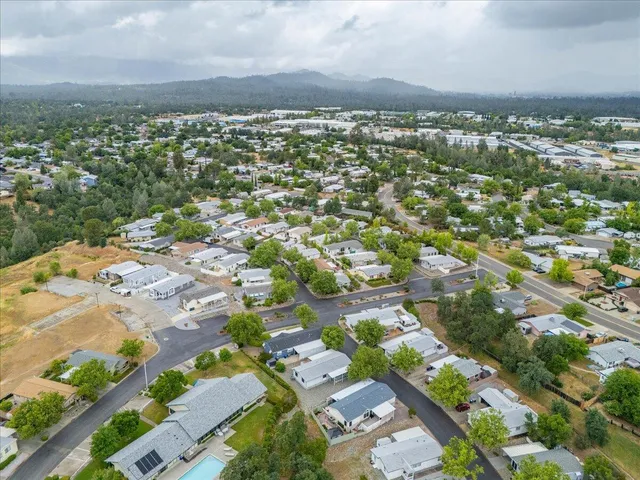 an aerial view of a house with a garden
