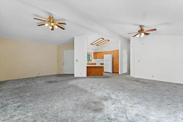 a view of a livingroom with a projector and a chandelier