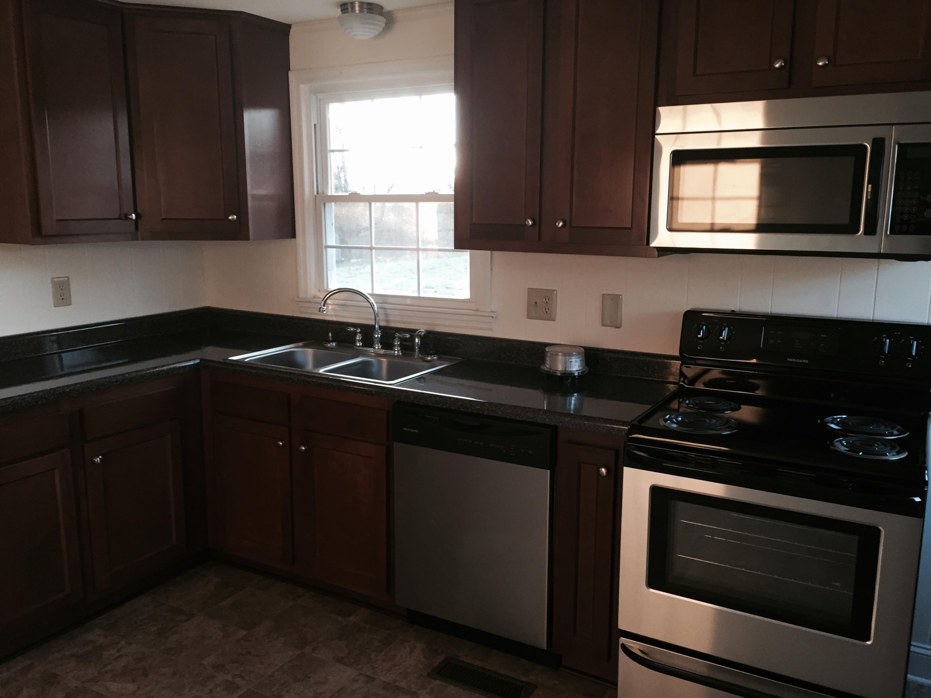 1425 Hardy Road Hardy, VA 24101 - Photo 4 of 10 a kitchen with a sink stove and microwave