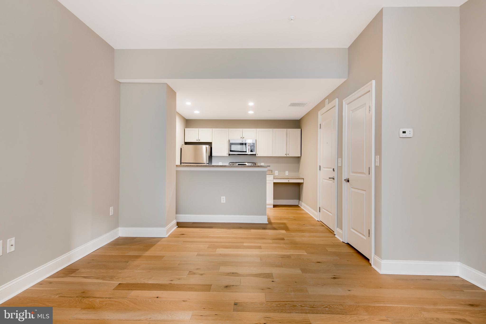 220 South 16th Street, Unit 902 Philadelphia, PA 19102 - Photo 5 of 16 a view of kitchen with wooden floor