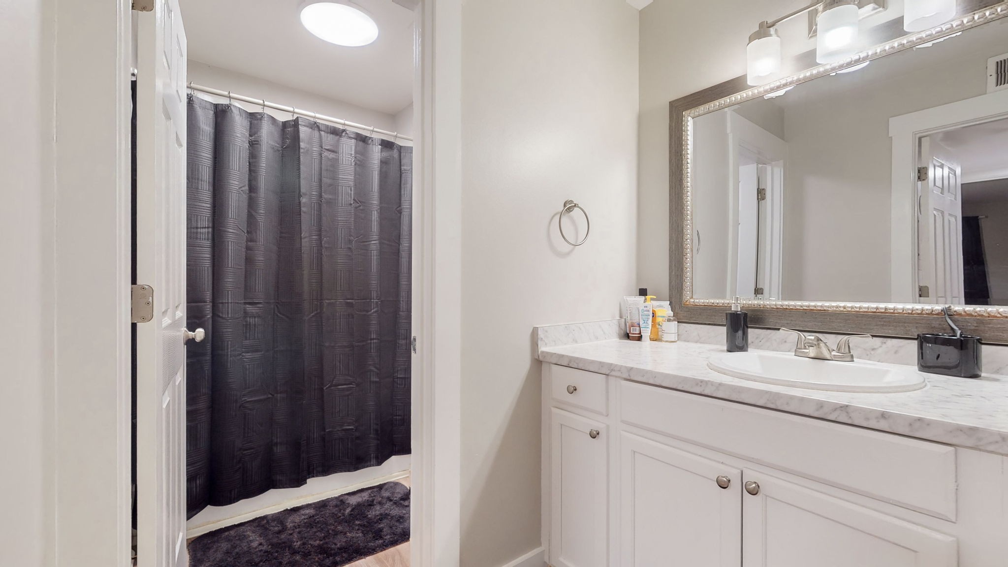 320 Welch Road, Unit P2 Nashville, TN 37211 - Photo 15 of 22 a bathroom with a double vanity sink and a mirror