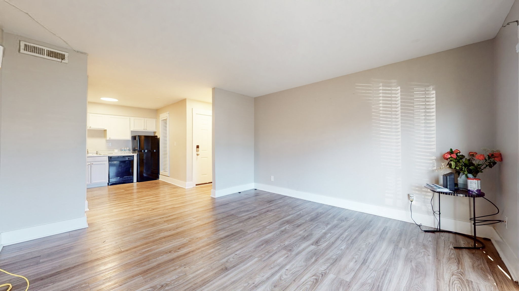 320 Welch Road, Unit P2 Nashville, TN 37211 - Photo 4 of 22 a view of an empty room with wooden floor and a window
