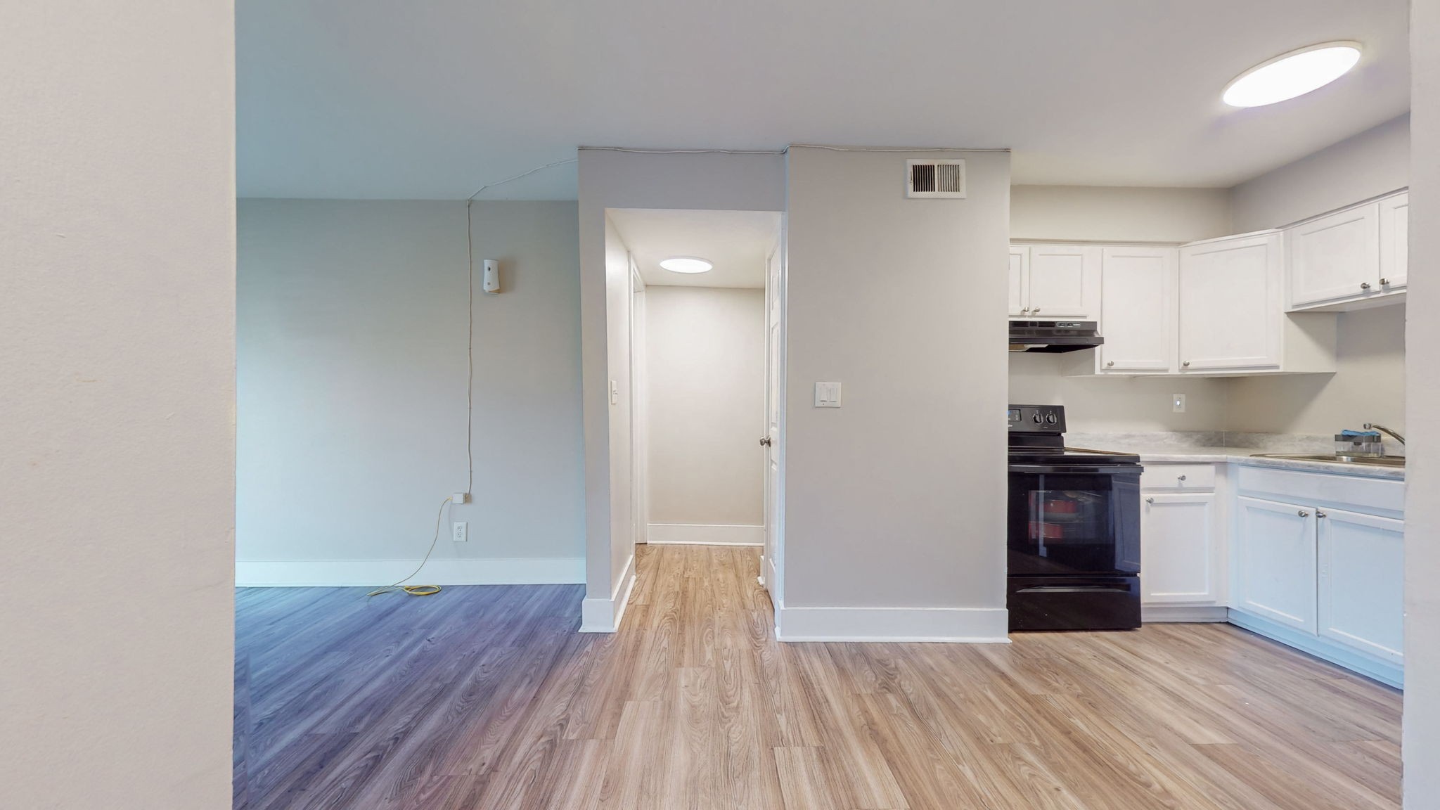 320 Welch Road, Unit P2 Nashville, TN 37211 - Photo 5 of 22 a kitchen with wooden floors and white appliances